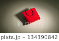 Bright red paper shopping bag with black handles fills the frame as the camera slowly zooms in. Animation for holiday shopping, seasonal sales, and festive retail promotions 134390842