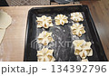 Footage of the pineapple puff pastries on the baking tray. Food 134392796