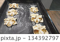 Footage of the pineapple puff pastries on the baking tray. Food 134392797