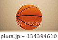 Spinning Basketball on Beige Background With Minimalist Studio Lighting 134394610