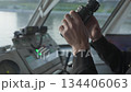 Ship captain looking through binoculars on the bridge. Clip 134406063