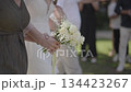 Parents escort bride to wedding ceremony. 134423267
