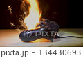 A game joystick fire with bright sparks is a concept of technological failure and accident.	 134430693