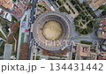 Breathtaking Aerial View of an Impressive Ancient Amphitheater in a Bustling City 134431442