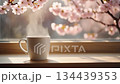 Cherry blossom season. Quiet spring scenery with steaming coffee by the window. 134439353