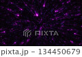 An abstract space background with bright purple rays and blue sparks coming from the center. 134450679