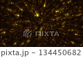 An abstract space background with bright golden rays and sparks coming from the center. 134450682