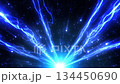 Abstract background with a blue glow and rays spreading out from the center. In the center, there is a hot light core, surrounded by smooth waves of light and small glowing dots. 134450690