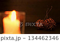 Sweetgum berries and candlelight 134462346