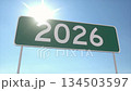 Green Road Sign With 2026 Under Bright Blue Sky and Sunlight 134503597