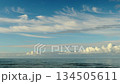 A view of a calm sea in winter, vibrant footage and an invitation to a Christmas holiday at winter seaside resorts 134505611