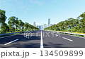 3D animation render of a clean multi-lane highway leading to a distant city skyline 134509899