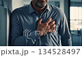 Middle aged european businessman having chest pain heart attack in modern office workplace 134528497