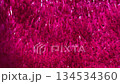 Glamorous fuchsia confetti pieces dancing in air creating dreamy romantic celebration scene 134534360