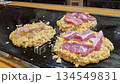 Hot freshly cook okonomiyaki Japanese style pizza on hot plate Osaka street food 4k 134549831