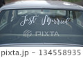 Just married sign on wedding car window. 134558935