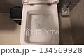 Flushing down the toilet 134569928