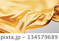 Flowing golden wave cloth background, 3d rendering. 134579689