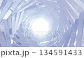 Abstract white metallic spiral tunnel with bright glowing center 134591433