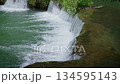 Beautiful tiered waterfall Slow Motion of smooth flowing water in Thailand. 134595143