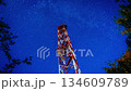 Night Timelapse of Communication Tower with Milky Way and Starry Sky, Technology and Space Background 134609789