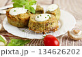 Rustic homemade potato and mushroom muffins with green garnish 134626202