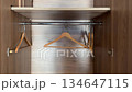 Empty wooden wardrobe interior with clothes hangers creating minimalist organization concept video 134647115