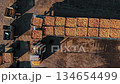 Loading apples. apple farming. apple harvest. apple crop. aero, top down. aerial view. apple boxes. unloading and loading of freshly picked apples, their further transportation 134654499