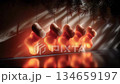 クリスマスツリーの枝に光る靴下を吊るして温かいお祭りムードを演出 134659197