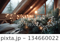 Christmas pine branch wreath and illuminations on a log cabin window in winter 134660022