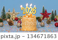 Happy New Year 2026, seamless loop of cute cake with golden ribbon with candle number 2026 for new year celebrate party was lit. decorate with Christmas ornament at blue background, horizontal 134671863