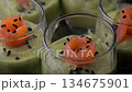 Smoked salmon shot glasses guacamole served with homemade crackers 134675901