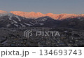 The beautiful morning glow of the Hakuba mountain range and the townscape of Hakuba Village, Nagano Prefecture (aerial shot by drone) 134693743