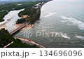 An estuary with a bridge crossing the river and a road running along the coast, Aerial view of beach and sea with green mangrove forest at Prachuap Bay, Prachuap Khiri Khan , Thailand 134696096