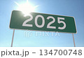 Green Highway Sign Showing 2025 Against Clear Blue Sky 134700748