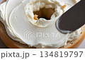 Delicious bagel gets cream cheese applied in smooth, elegant motions and steps 134819797