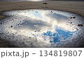 Clouds Reflecting in Puddle with Raindrops Creating Ripples Slow Motion 134819807