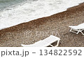beach with sun loungers and beautiful wave on sea at storm at cloudy day. close up. Black sea 134822592