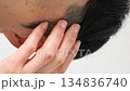 Video of a Japanese man touching his hair 134836740