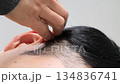 Video of a Japanese man styling his hair 134836741