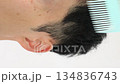 Video of a Japanese man combing his hair 134836743