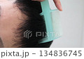 Video of a Japanese man combing his hair 134836745