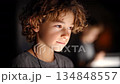 Curious boy focuses on screen to learn and explore 134848557