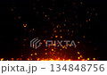 Fiery Spark Eruption on Black Background: A mesmerizing display of glowing sparks erupts from a fiery source against the stark black backdrop, creating a dynamic and intense visual representation. 134848756