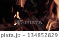 Flames of a fireplace wood fire 134852829