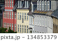 Colorful urban building facades with many windows and varied rooftops creating european architecture. Copenhagen, Denmark 134853379