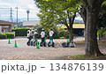 A group practicing riding Segways in the park 134876139
