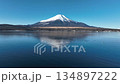 Aerial view of Mount Fuji and wild birds floating on the lake in clear skies 134897222