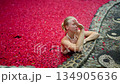 Exotic spa pool with flower petals floating on water 134905636
