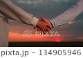 People close deal outdoors. Business partners man woman shake hands in park sunset. Close-up businessmen, man woman, shaking hands outdoors, teamwork. Concept business handshake, people outdoors, sun 134905946
